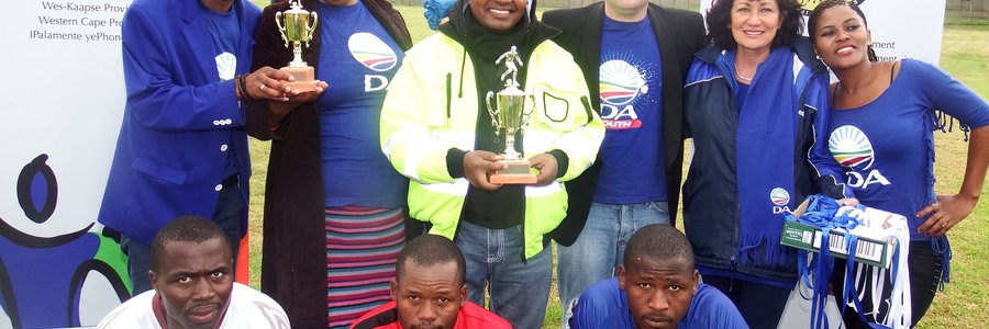 Back fltr are Lindile Ntsabo (Zwelihle), Cllr Linda Ndevu (Masakhane), MP Masizole Mnqasela, Grant Cohen (Youth Overstrand Chairperson), Cllr Riana de Coning (Gansbaai) and Ntsiki Siwela (Zwelihle). In the front row is the team captains and match officials.